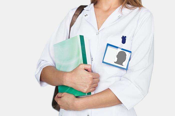 Woman with folders and badge