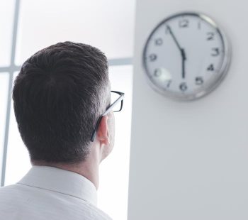 Man watching clock.